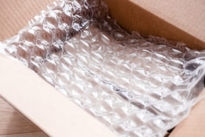 Plastic wrap with big bubbles in carton box