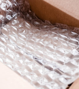 Plastic wrap with big bubbles in carton box