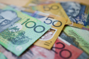 A pile of Australian currency with a shallow depth of field
